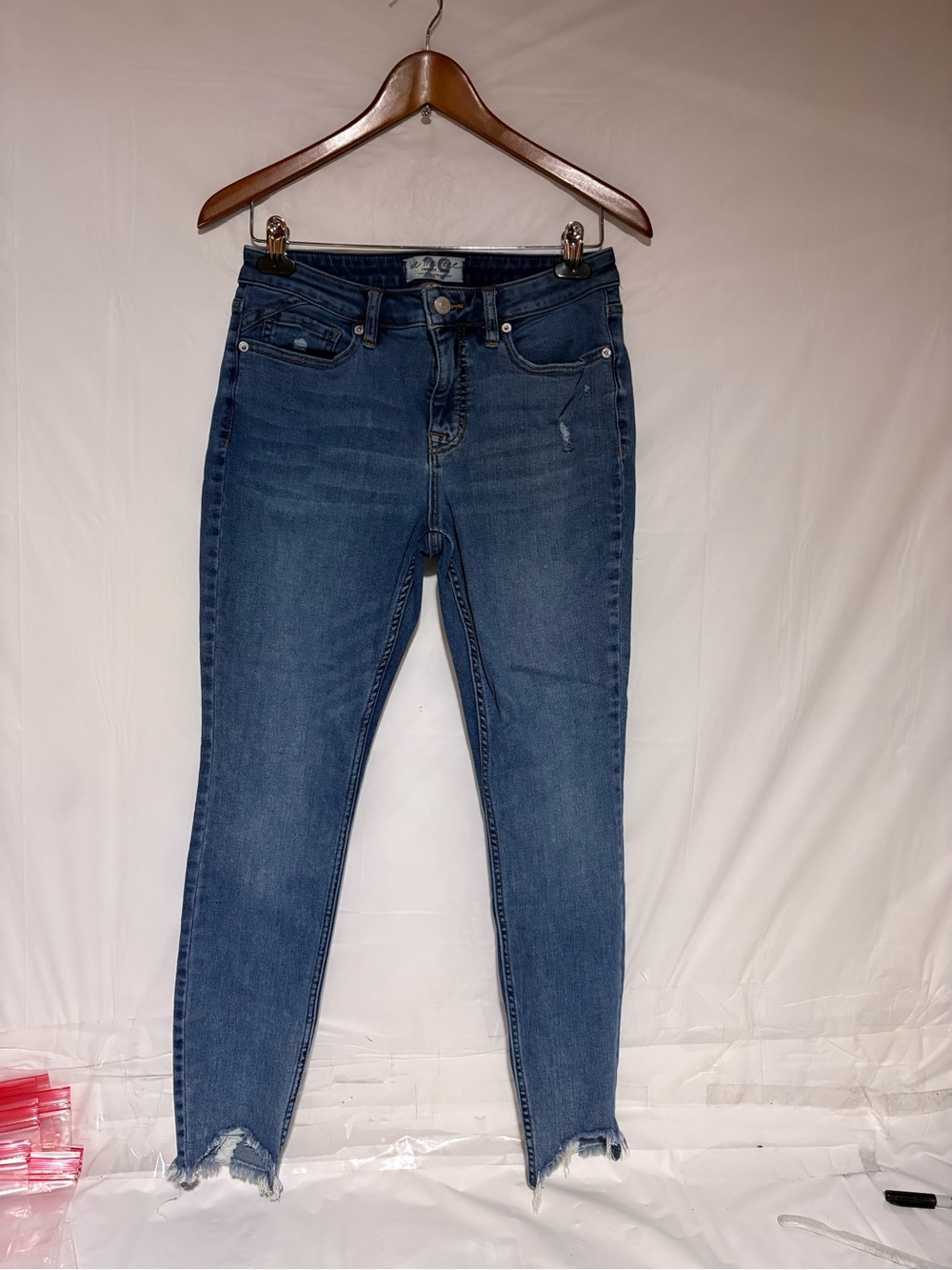 We The Free Skinny Jeans in Medium Blue Wash with Frayed Hem